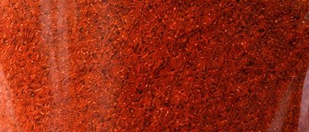 Close-up of Shri Gopal Ji red chilli powder, seen through the pouch window